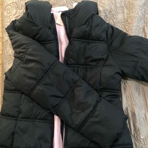 Black puffer jacket with pink fleece lining